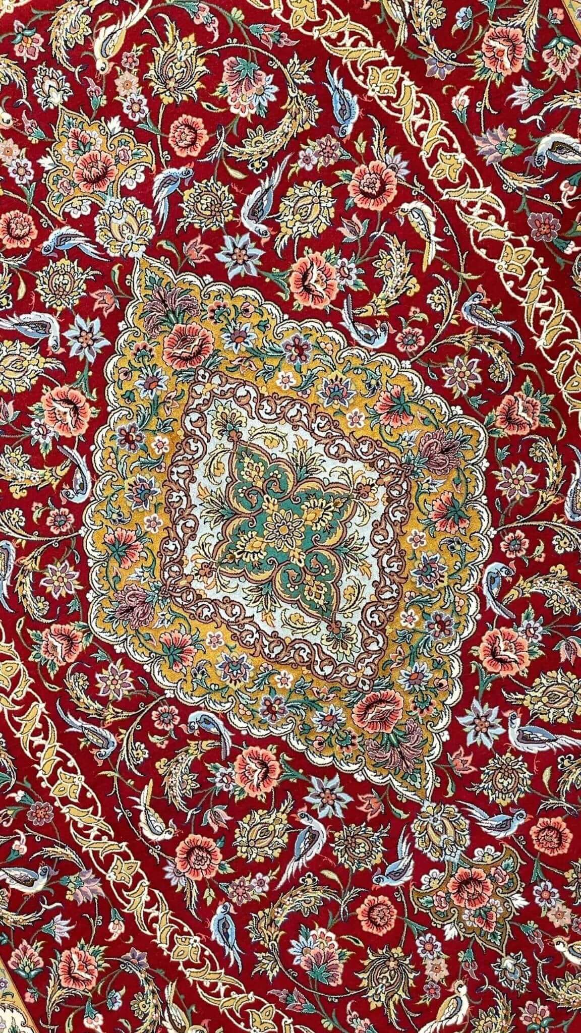 "Authentic Persian Isfahan rug, 240x160 cm, hand-knotted with a luxurious wool and silk blend, featuring intricate floral patterns."